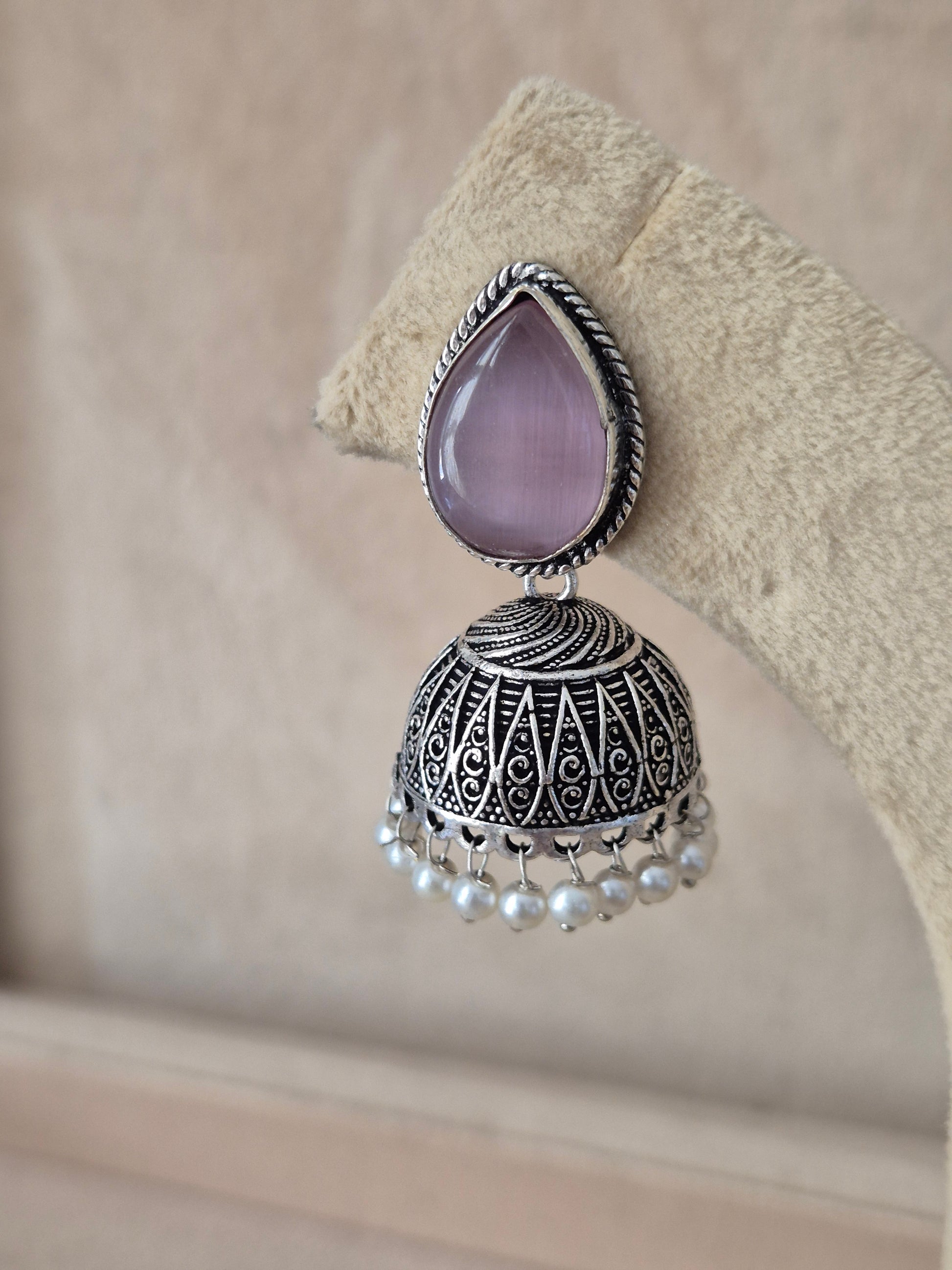 Naitri premium oxidized silver geometric drop earrings with pink stones from the Silver Jewellery collection by naitri.in