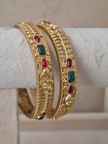 Esha Bangles set of 2, traditional Indian gold-plated bangles with red and green stones, ethnic festive and wedding jewelry collection by Naitri.in