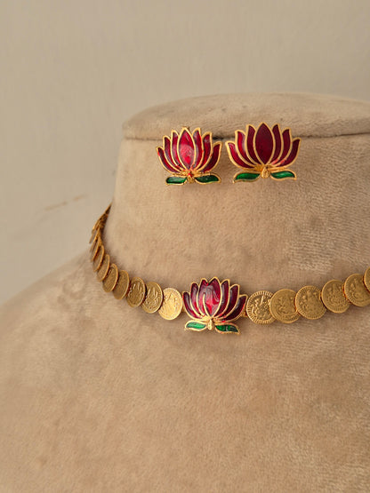 gold-toned choker necklace set featuring a central pink and green lotus flower motif with matching lotus stud earrings by naitri.in