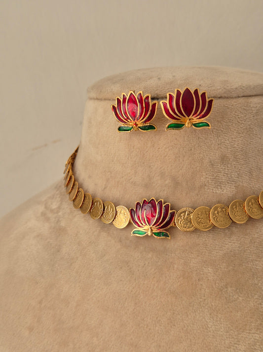 gold-toned choker necklace set featuring a central pink and green lotus flower motif with matching lotus stud earrings by naitri.in
