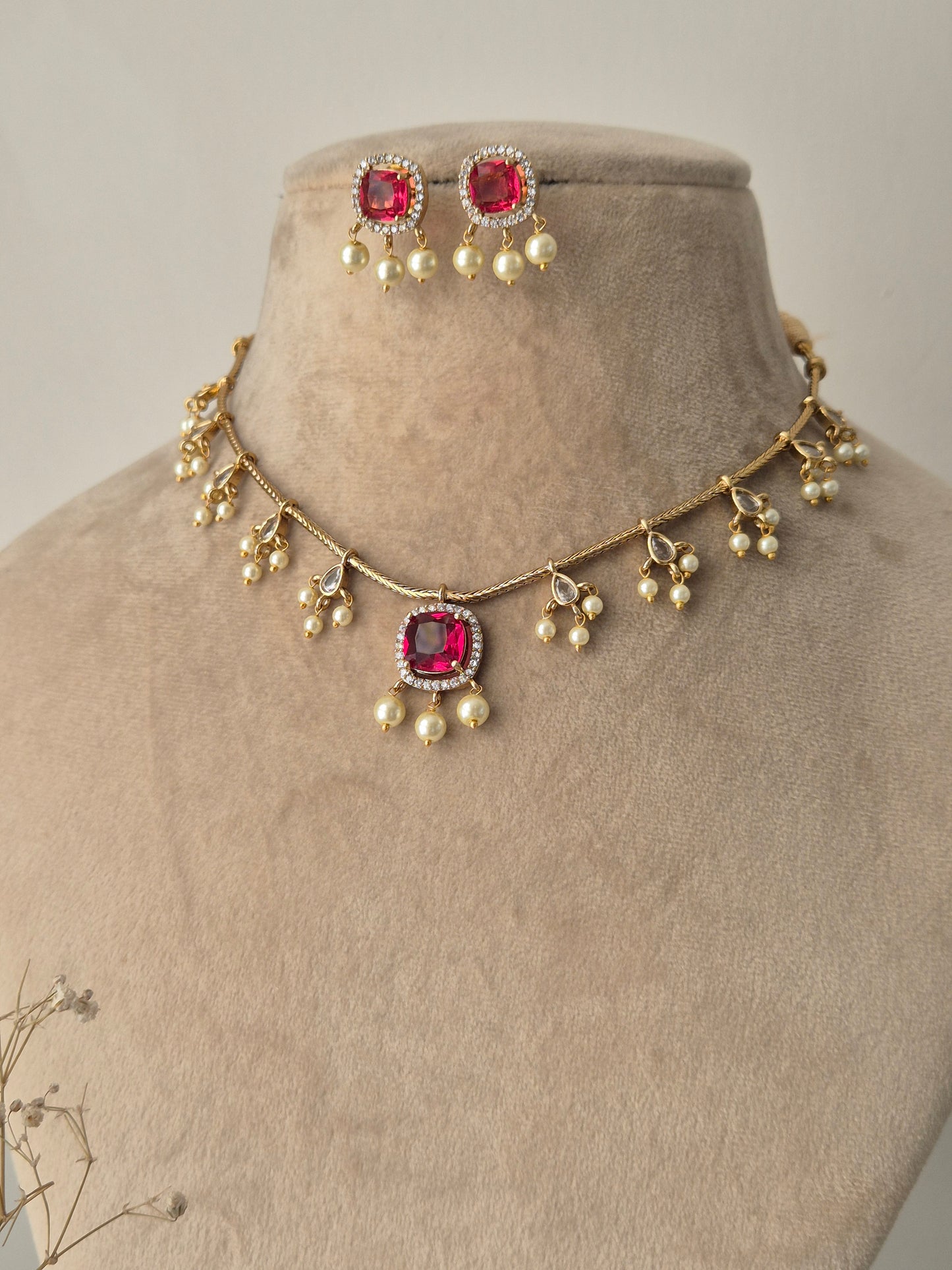 Naitri Golden Handmade imitation necklace set with pink stones and polished brass finish by naitri.in