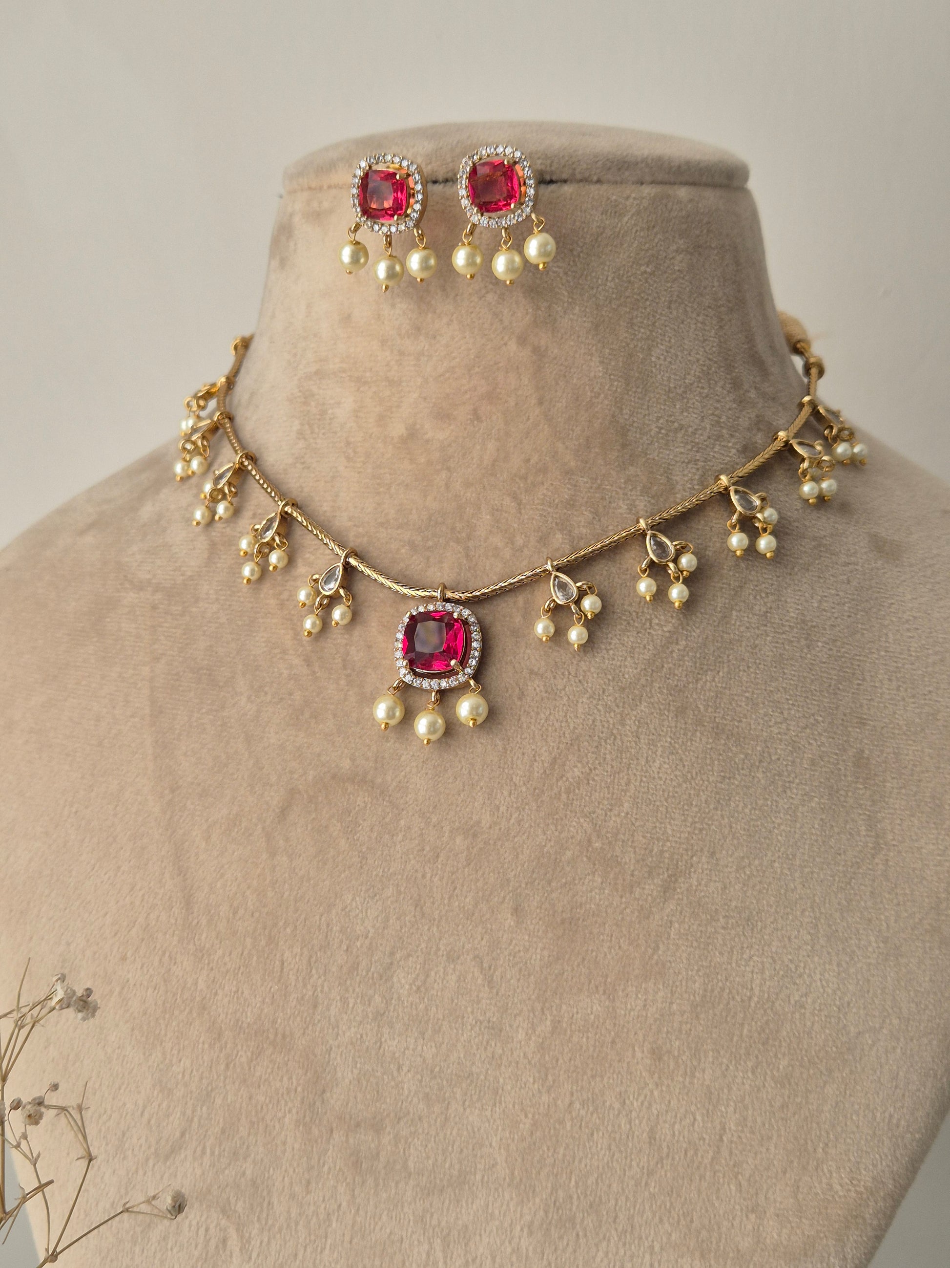 Naitri Golden Handmade imitation necklace set with pink stones and polished brass finish by naitri.in