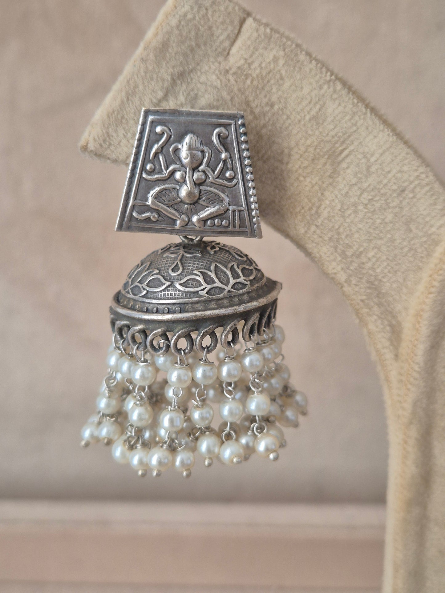 Modern Indian aesthetic silver-plated statement earrings featuring textured square studs and classic jhumka bells by naitri.in