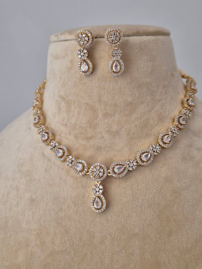 Close-up of the Lisha Necklace Set from Naitri, featuring a delicate floral stone-studded design in brass alloy by naitri.in