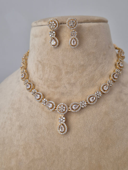 Close-up of the Lisha Necklace Set from Naitri, featuring a delicate floral stone-studded design in brass alloy by naitri.in