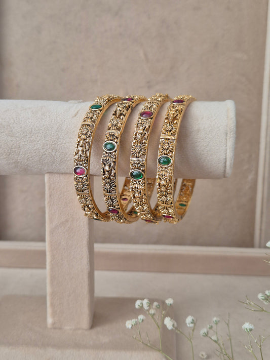 Malati Bangles set of 4, traditional Indian gold-plated bangles with red and green stones, ethnic festive and bridal jewelry collection by Naitri.in