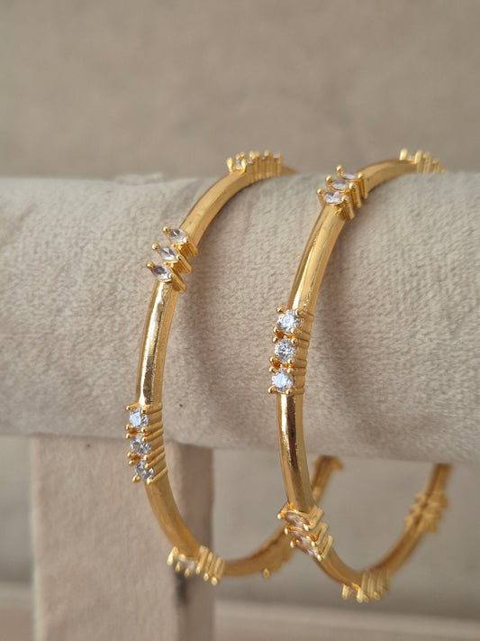 set of 2 antique gold-plated bangles featuring intricate traditional filigree work and floral carved motifs, by naitri.in