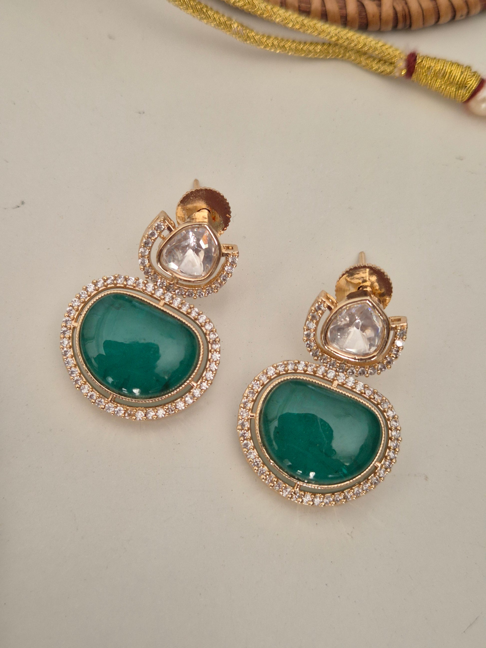 Modern Indian festive jewelry: Emerald green and American diamond necklace set for sarees and lehengas by naitri.in