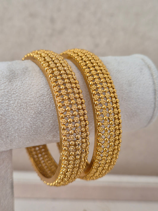 Noni Bangles set of 2 – traditional gold-plated ethnic bangles with textured beadwork detail by Naitri.in