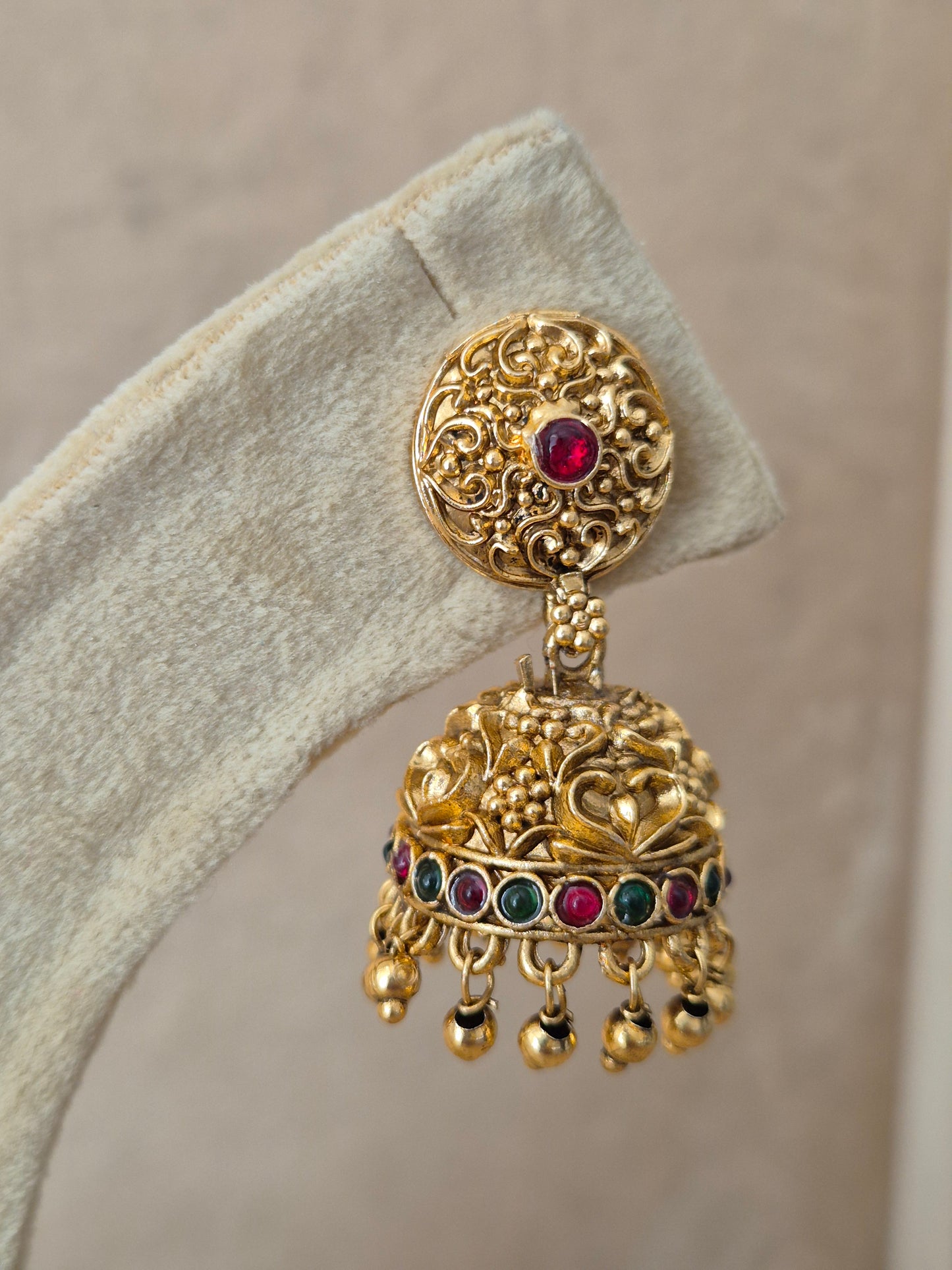 Gold-plated antique Jhumka earrings featuring ruby-colored stone, Handcrafted Indian traditional gold Jhumka earrings by Naitri, featuring ethnic floral and bead designs. by naitri.in