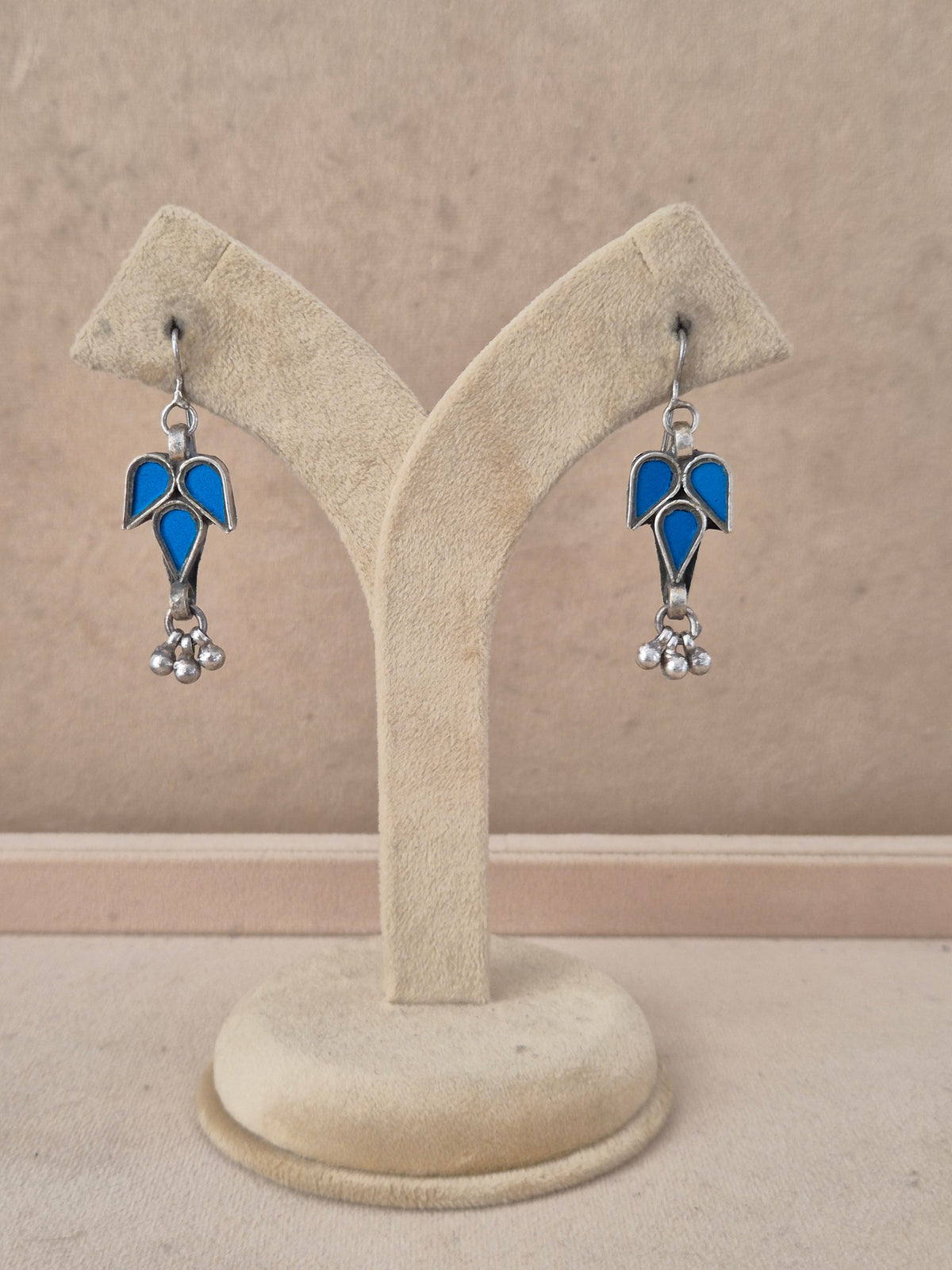 Pair of blue leaf-shaped glass drop earrings with silver bead details, Handcrafted blue glass dangle earrings with silver alloy accents by naitri.in