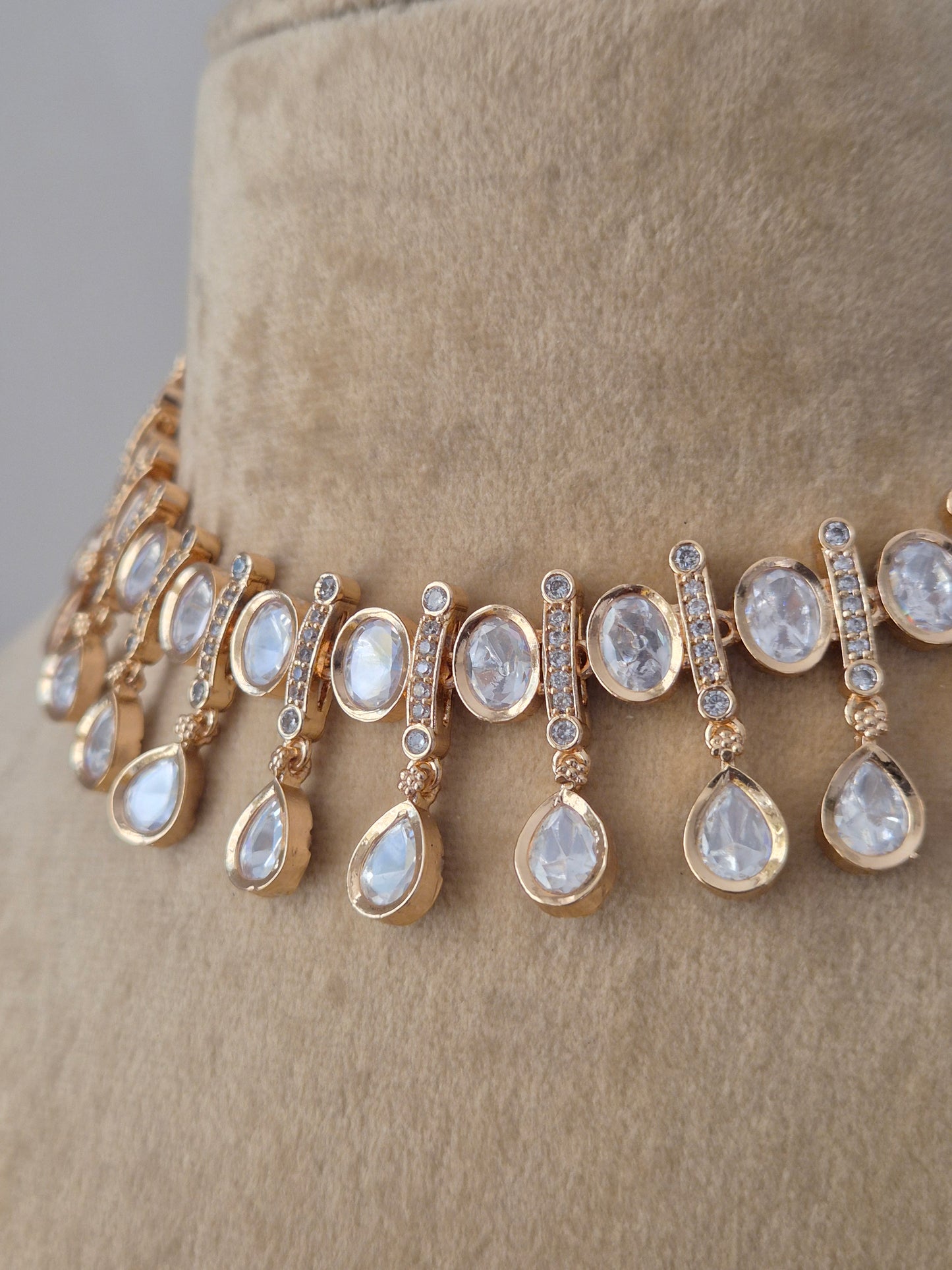 Handcrafted alloy necklace set from the Naitri collection, featuring high-quality American Diamonds in a choker style with a polished rose-gold finish by naitri.in