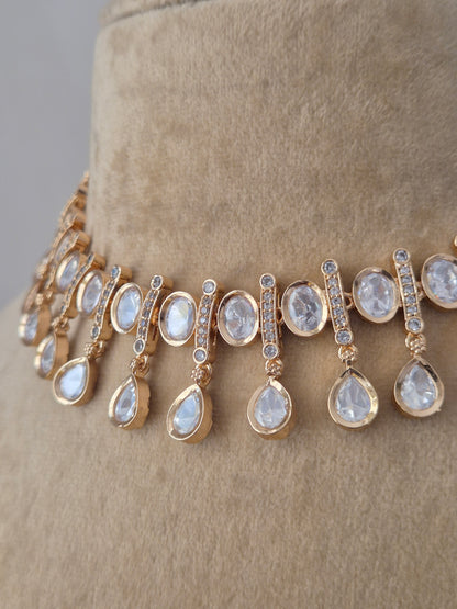 Handcrafted alloy necklace set from the Naitri collection, featuring high-quality American Diamonds in a choker style with a polished rose-gold finish by naitri.in