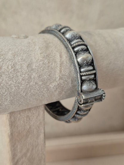 Close-up of Naitri Warisha premium silver oxidized bangle bracelet featuring traditional Indian style metalwork and geometric engraving by naitri.in