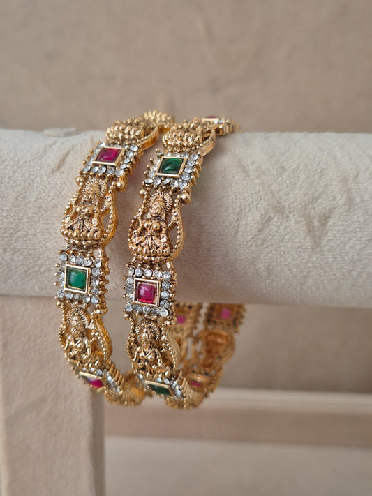 Yogshi Bangles set of 2, traditional Indian temple jewelry gold-plated bangles with red and green stones, ethnic bridal and festive collection by Naitri.in