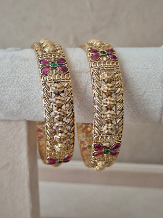 Zahira Bangles set of 2, traditional Indian gold-plated bangles with red and green stones, ethnic festive and bridal jewelry collection by Naitri.in