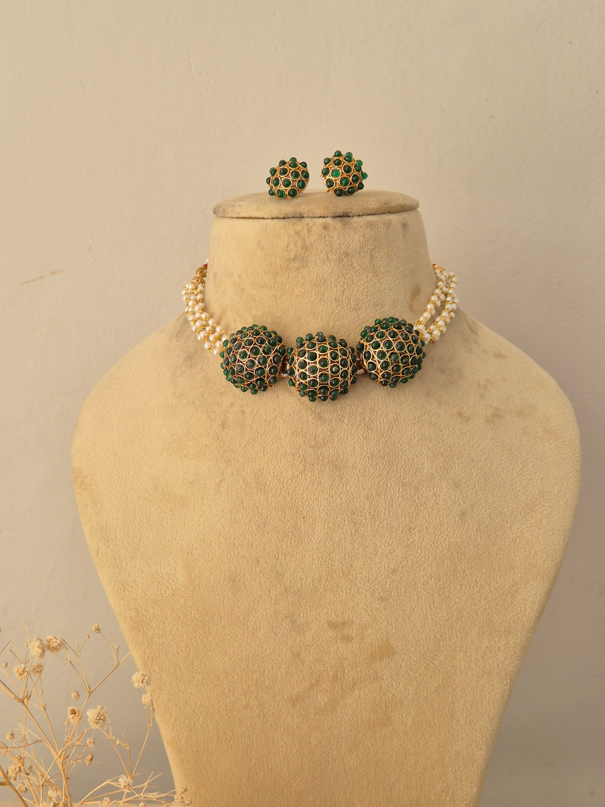 Handcrafted brass alloy traditional Indian pendant necklace on a black beaded chain with stone embellishments by Naitri.in