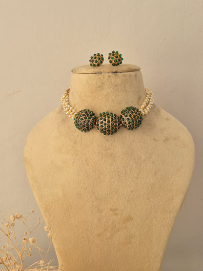 Handcrafted brass alloy traditional Indian pendant necklace on a black beaded chain with stone embellishments by Naitri.in