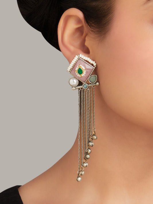 Red and pink stud earrings, Kajal by Naitri, stone design on white.