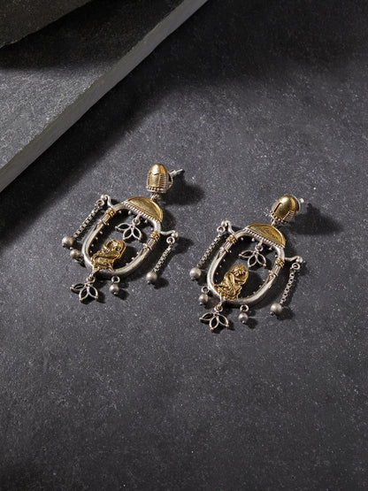 Red and gold stud earrings with bold stone embellishments