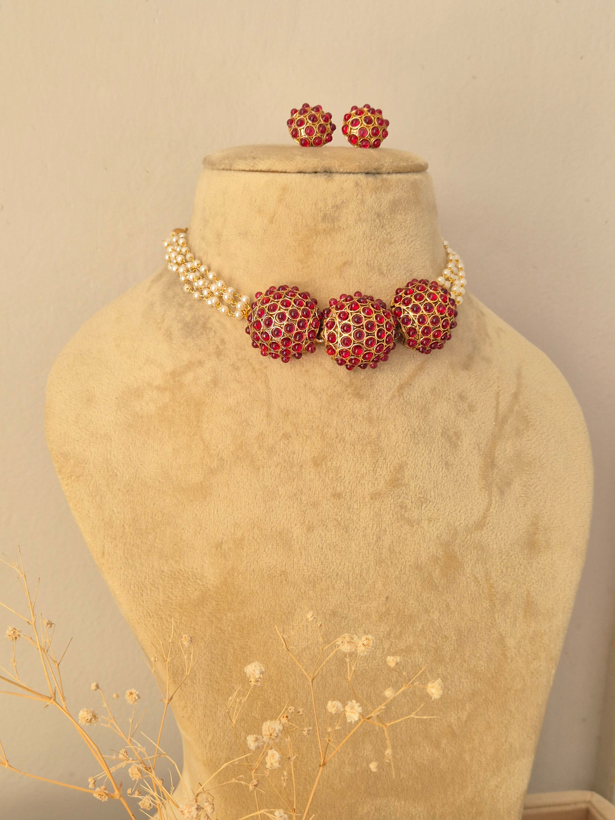 Aakriti Necklace Set with red stones and pearls by Naitri.in