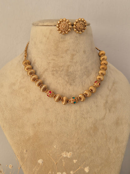 Gold-toned Alisha bead necklace set with matching earrings by Naitri.in