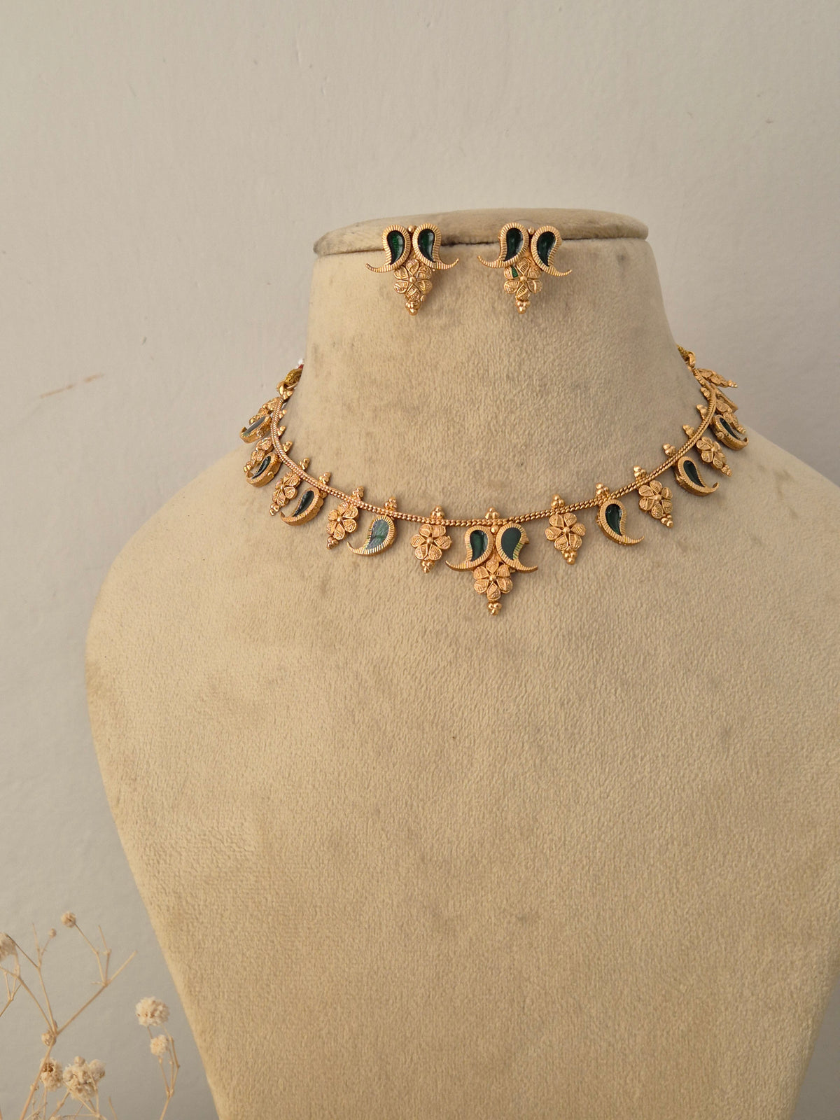Handcrafted brass alloy traditional Indian pendant necklace on a black beaded chain with stone embellishments by Naitri.in