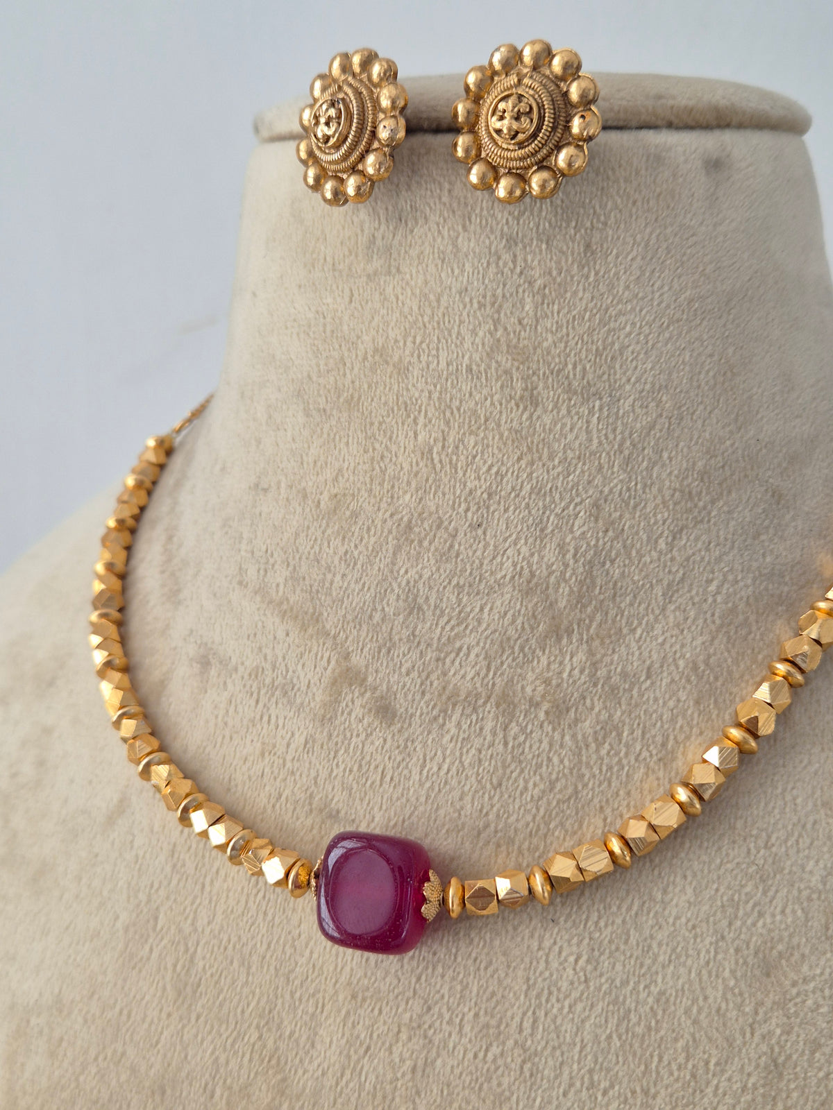 Handcrafted brass alloy ethnic choker and matching earrings by Nairi.in