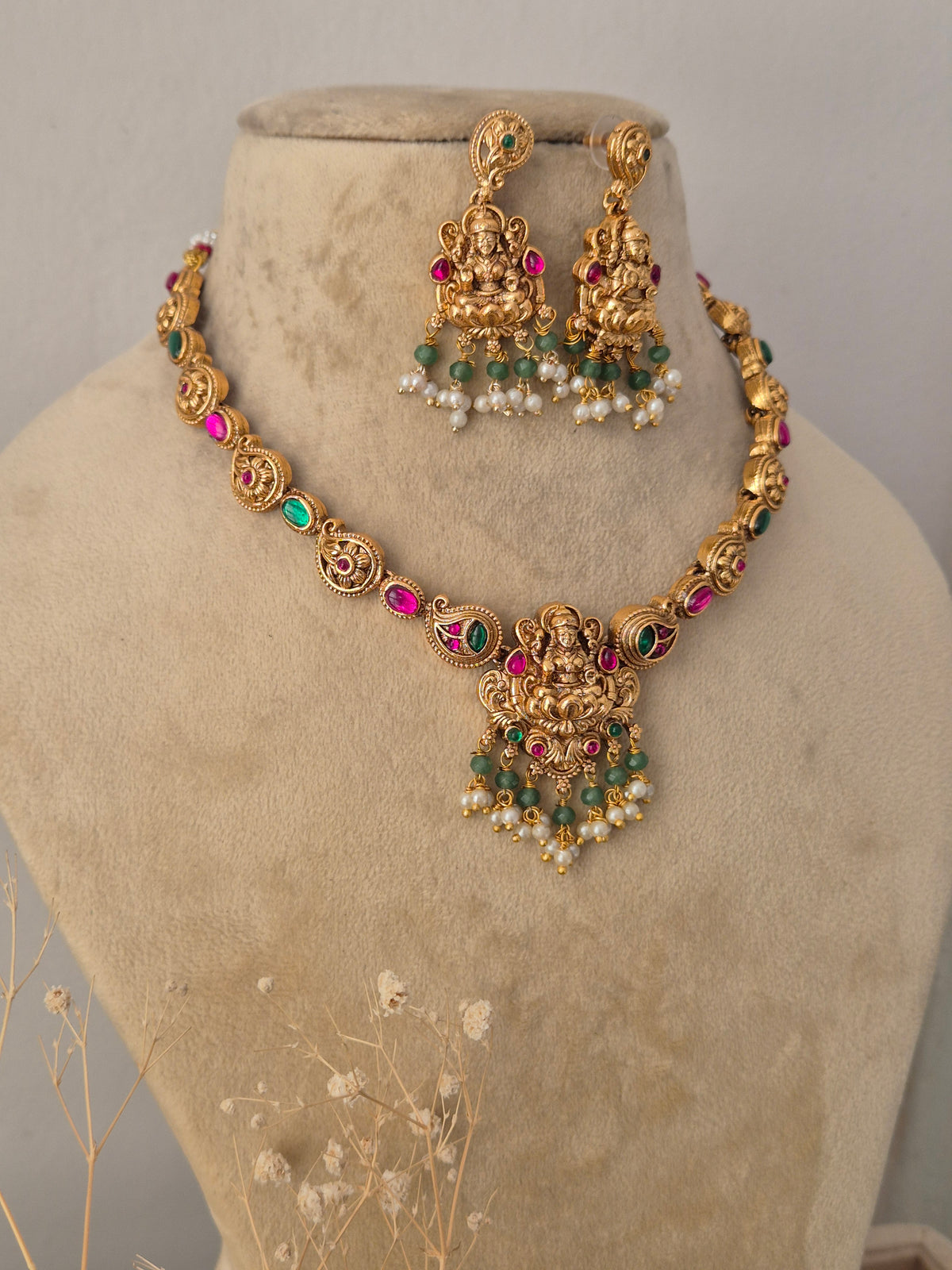 Gold-plated traditional Devi necklace set with gemstone by Naitri.in