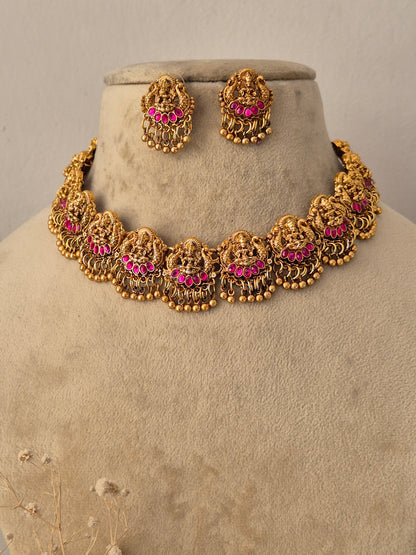 Traditional Indian ethnic gold necklace set with gemstone details by Naitri.in
