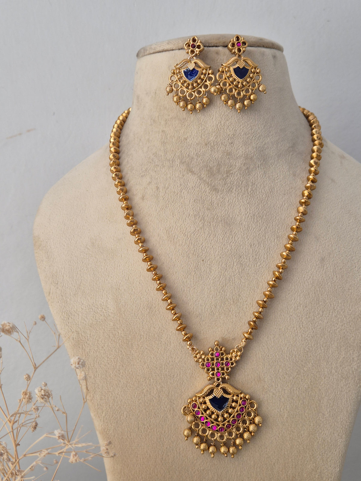 Handcrafted brass alloy traditional Indian pendant necklace on a black beaded by Naitri.in