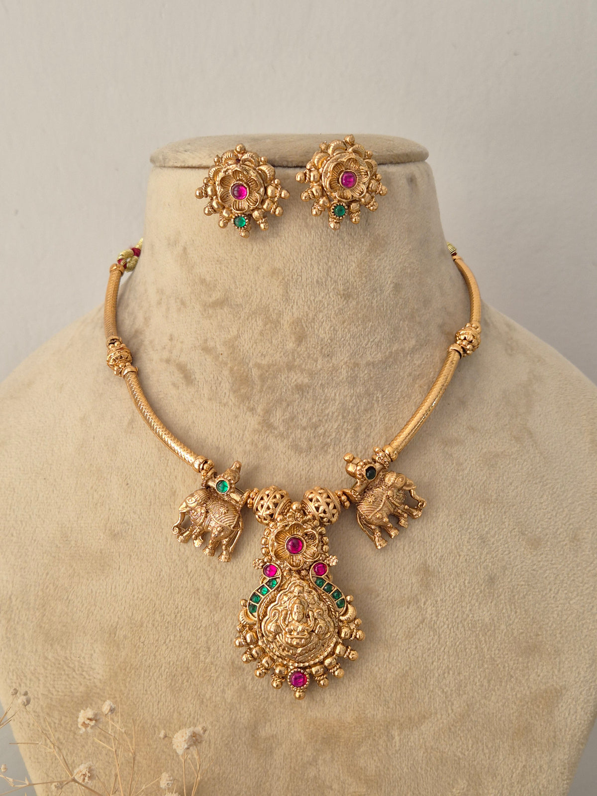 Handcrafted brass alloy necklace set featuring intricate Indian artisanal work, central pendant detailing, and matching earrings by Naitri.in