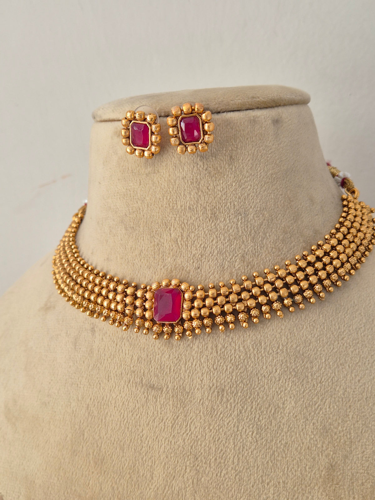 Handcrafted brass alloy ethnic choker and matching earrings from the Naitri golden jewelry collection by Naitri.in