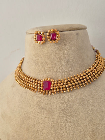Handcrafted brass alloy ethnic choker and matching earrings from the Naitri golden jewelry collection by Naitri.in