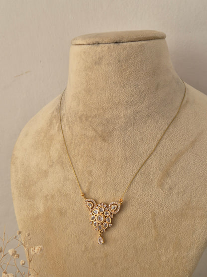Handcrafted brass alloy traditional Indian pendant necklace on a fine gold-tone invisible chain by Naitri.in