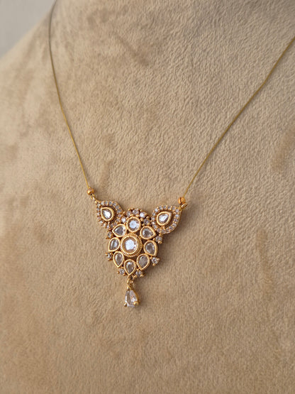 Traditional Indian ethnic gold pendant necklace with intricate craftsmanship by Naitri.in