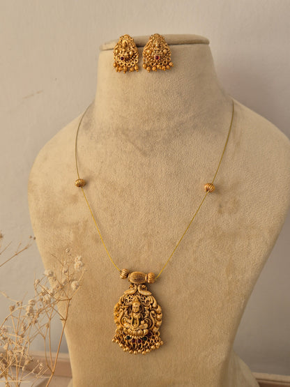Handcrafted brass alloy traditional Indian necklace set with intricate deity carvings and stone embellishments by Naitri.in