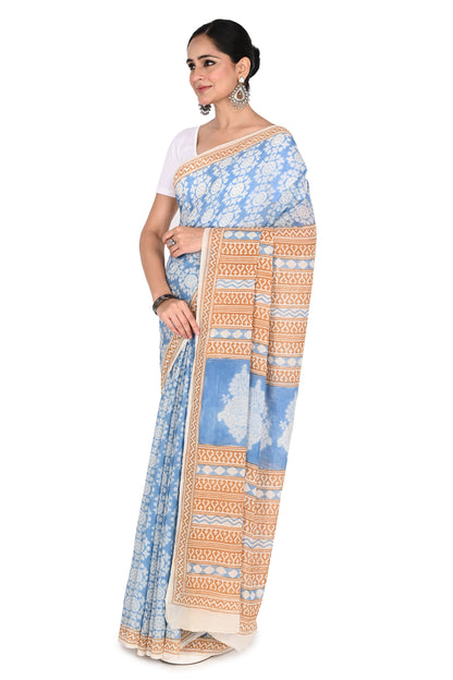 Traditional Bagh hand block print in blue on a handcrafted white cotton saree, showcasing artisanal craftsmanship from Madhya Pradesh by naitri.in