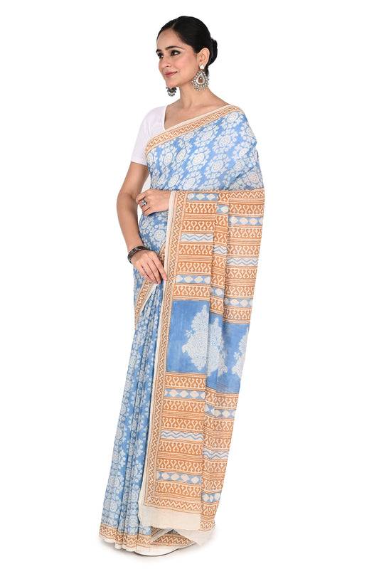 Traditional Bagh hand block print in blue on a handcrafted white cotton saree, showcasing artisanal craftsmanship from Madhya Pradesh by naitri.in