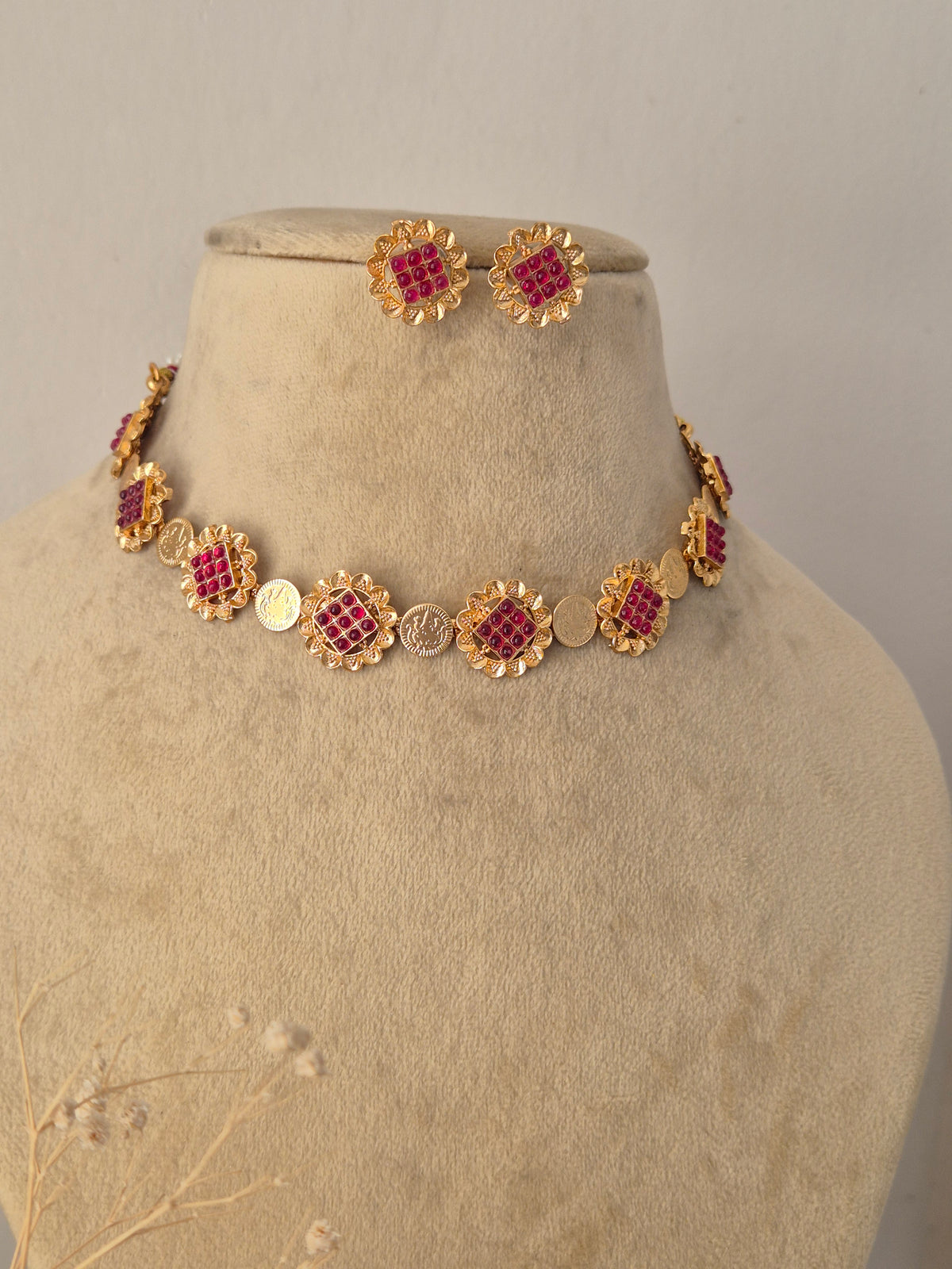 Traditional Indian Imitation Jewelry Set showcased against a clean background, highlighting the intricate red gemstone detailing, polished gold-tone finish, and classic ethnic craftsmanship by Naitri.in