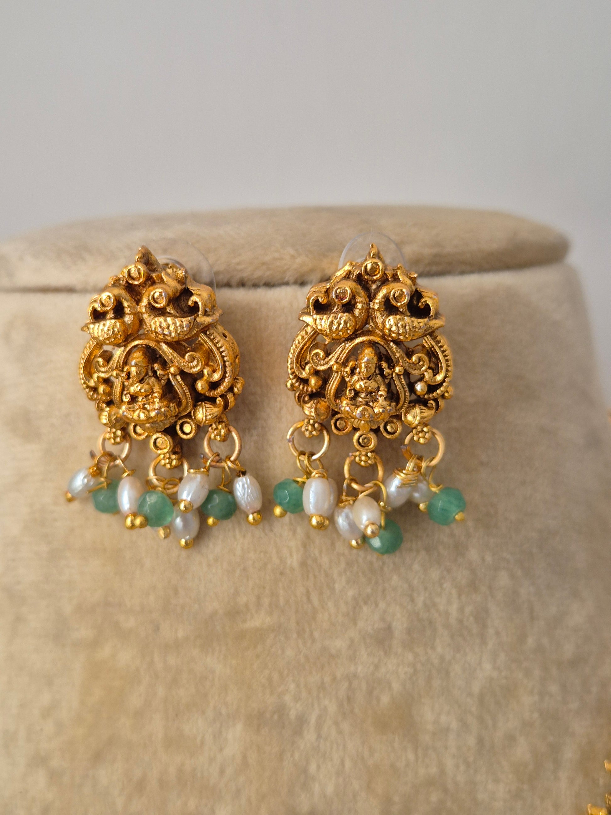 Gold earrings with green and white beads Artisanal Nandan earring in a modern Indian aesthetic, by naitri.in