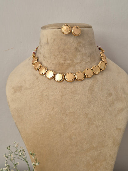 Modern Indian style delicate golden brass alloy coin choker necklace and earring set from the NAITRI, Handcrafted antique gold statement choker set by naitri.in