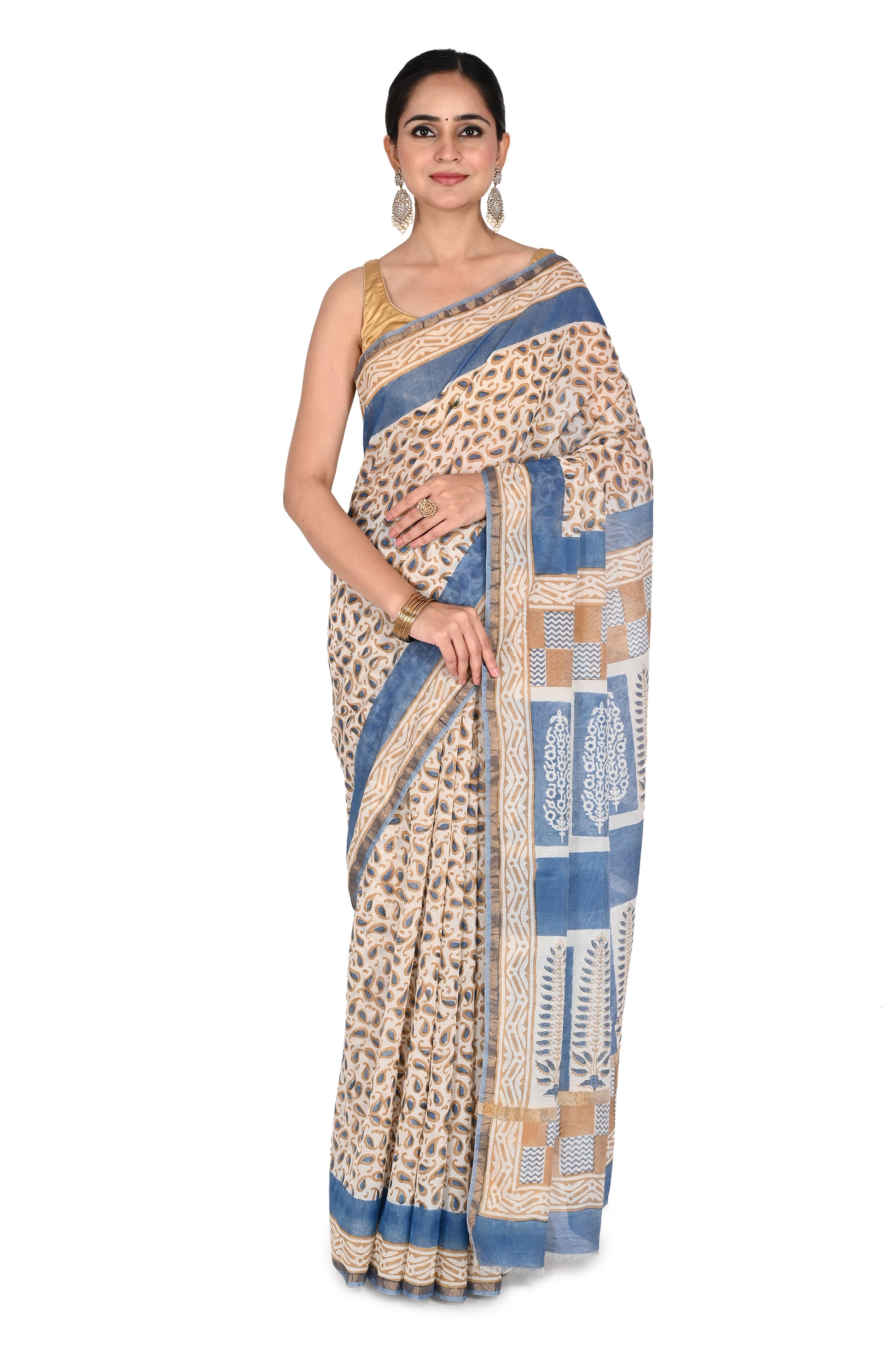 Woman modeling a blue and beige hand block printed cotton silk saree with intricate geometric patterns and a classic drape by naitri.in