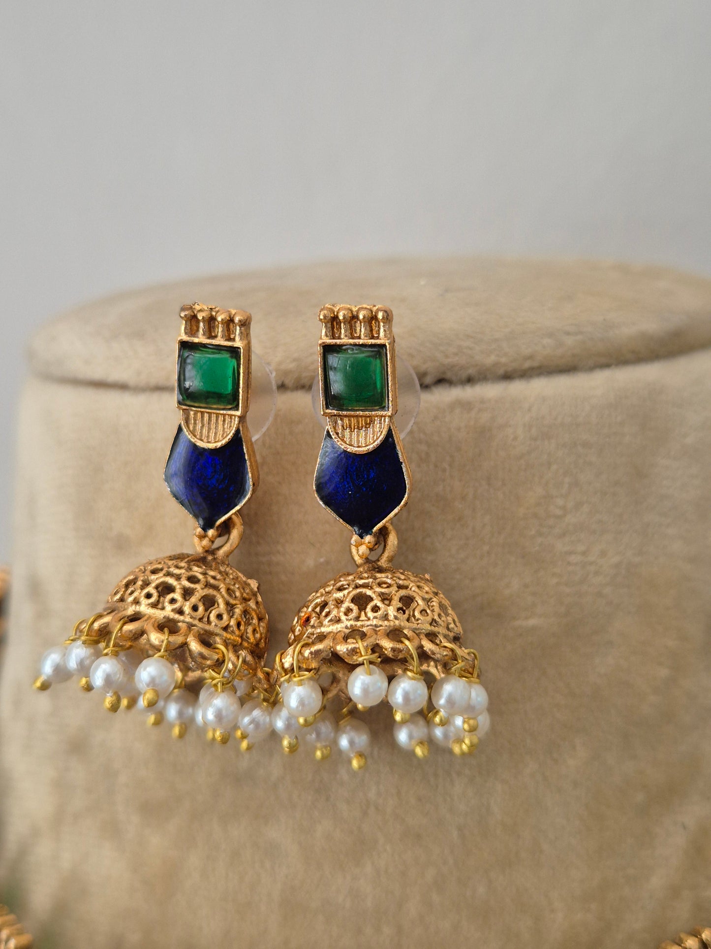 Gold-plated earrings with blue and green gemstones jhumka dangling earrings featuring tiny white pearl by naitri.in