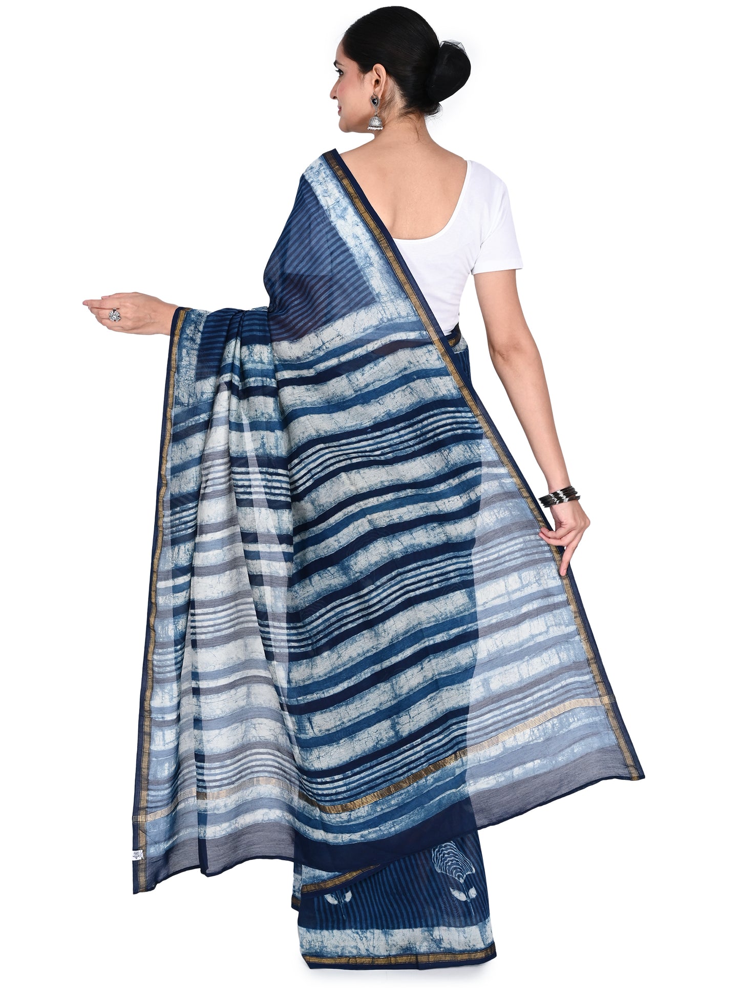 A navy blue and white hand-block printed saree in a fluid cotton-silk blend, showcasing traditional Indian heritage and contemporary style by naitri.in