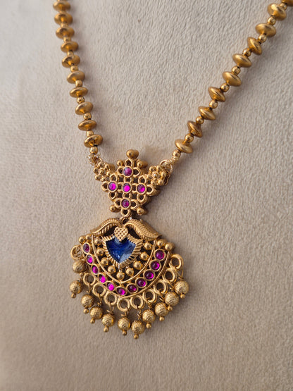 Gold-plated traditional Ananya necklace and earring set with gold beaded chain by Naitri.in