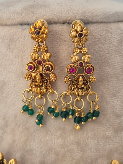 Gold temple earrings  with pink stones and green bead drops by naitri.in