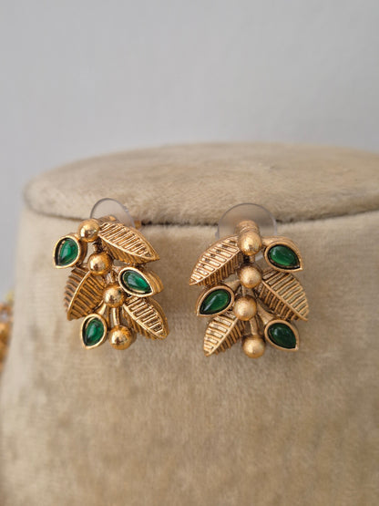 Gold-plated with green leaf-shaped gemstones by naitri.in
