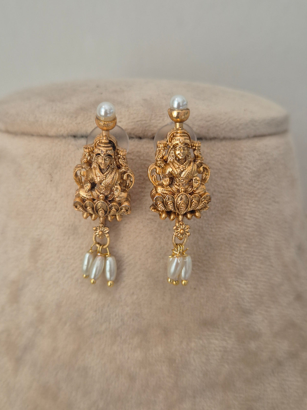 Traditional gold temple earrings with with dangling pearls, by naitri.in
