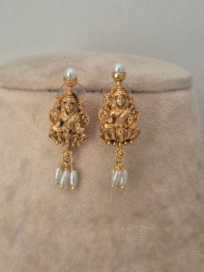 Traditional gold temple earrings with with dangling pearls, by naitri.in